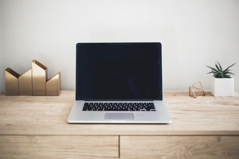 A laptop on a wooden table